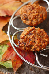oatmeal cookies on the grill on a table covered with autumn lea