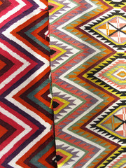Colourful rug background divided into two sections