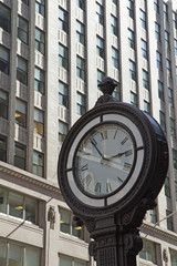 Fototapeta na wymiar Street clock on the street in Manhattan.