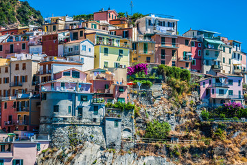 Fototapeta na wymiar Village of Manarola with ferry, Cinque Terre, Italy