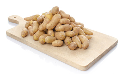 New rattes potatoes on a wooden board