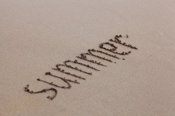 beach sand summer inscription on the sand