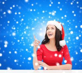 smiling woman in santa helper hat