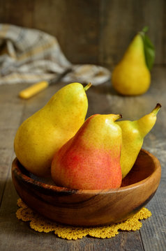 Pears in a wooden bowl.
