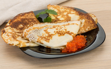 Pancakes with red caviar