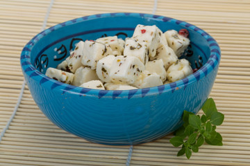 Cheese with spices and oil