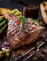 Beef steak on wooden table