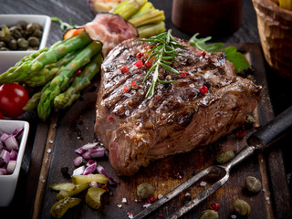 Beef steak on wooden table