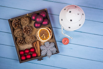 Retro wooden box with Christmas decorations and lantern