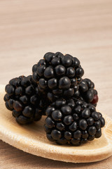 blackberries on a wooden spoon