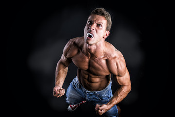 Shirtless Muscle Man with Pointed Teeth Howling