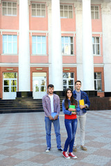 Fototapeta na wymiar Students near university