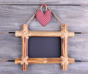 Rectangular chalkboard on wooden background