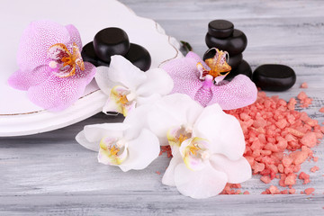 Obraz na płótnie Canvas Colorful tropical orchid flowers and spa stones