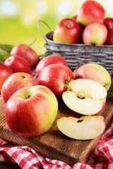 Sweet apples  on table on bright background