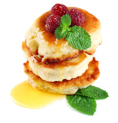 Tasty pancakes with fresh berries and mint leaf, isolated
