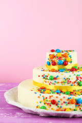 Fototapeta na wymiar Beautiful tasty birthday cake on color background