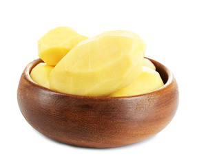 Raw peeled potatoes in bowl isolated on white