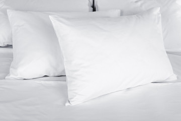 Fototapeta White pillows on bed close up obraz