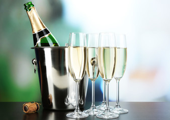 Champagne in glasses and bottle in restaurant