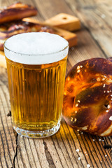 Refreshing beer ready to drink and fresh bavarian pretzels