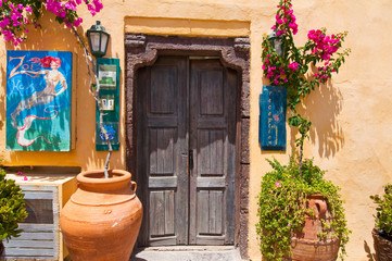 Fototapeta na wymiar Local hotel on the Oia street. Santorini, Greece.