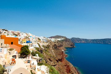 Oia with whitewashed buildings in the rock. Thira (Santorini). © lornet