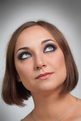 Obraz premium Portrait of the girl closeup on a gray background