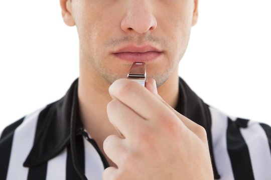 Mid Section Of Referee Blowing Whistle