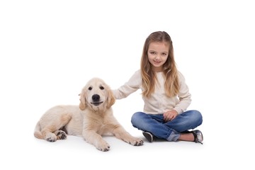 Girl holding her puppy close