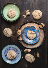 cookies with cracks in blue bowl on old wooden table