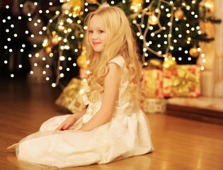 Christmas and people concept - happy smiling little girl