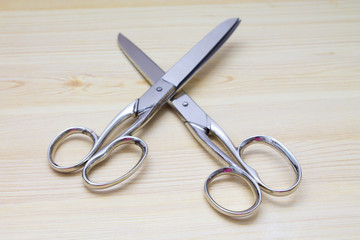 scissors on wood background