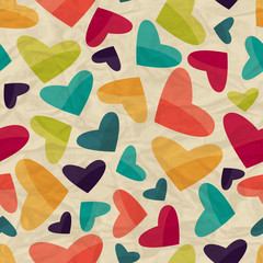 Seamless pattern with hearts on crumpled paper.
