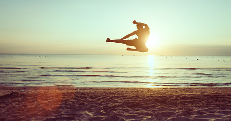 flying kick on the beach