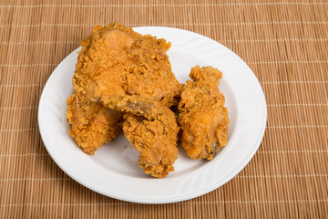 Fried Chicken on Small Plate and Bamboo Placemat