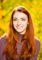 smiling redhead woman fall season portrait