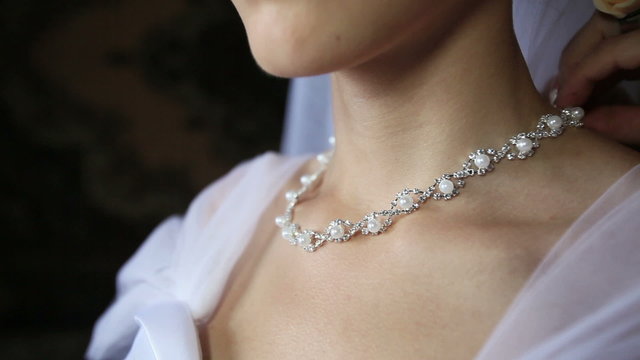 bride necklace of pearls in a silver frame