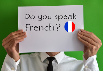 Businessman showing a sheet with text Do you speak French