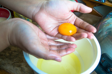 hand prepare egg yolk