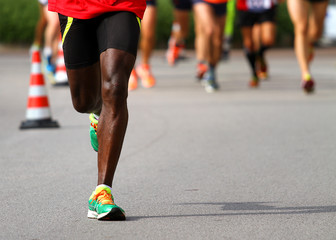 Fototapeta premium athlete runs down the street during the race outdoors