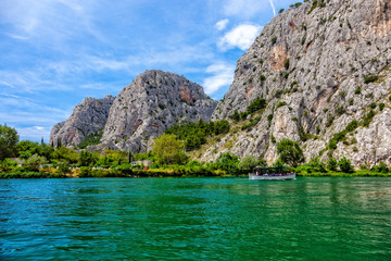 Tourist boat on the River Cetina in Omis, Croatia.