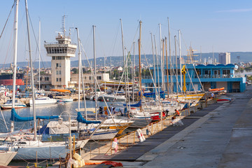 Sailing yachts and pleasure boats stand in port of Varna - obrazy, fototapety, plakaty