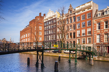 Naklejka premium Colorful living houses on the canal coast in Amsterdam, Netherla