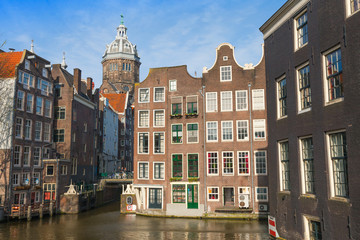 Obraz premium Streetview with colorful brick houses and dome of St. Nicolas Ch