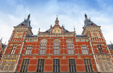 Obraz premium Facade of Amsterdam Centraal old building. Central railroad stat