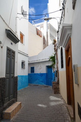 Fototapeta na wymiar Narrow street of old Medina. Historical center of Tangier, Moroc