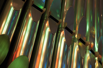 Colorful shining organ tubes in Catholic Church