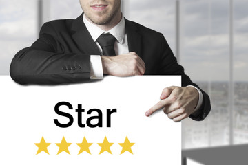 businessman pointing on sign star golden rating