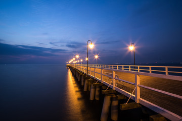 Sunrise on the pier at the seaside, Gdynia Orlowo, Poland